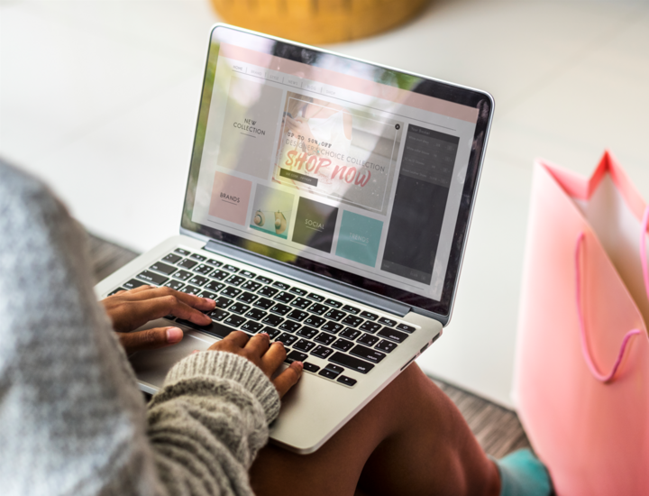 Woman working on a laptop on Ecommerce Product Page SEO